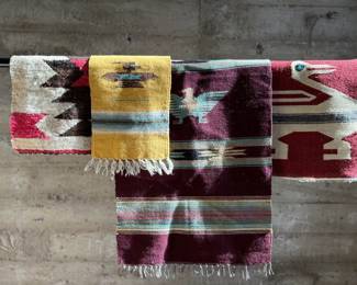 This lot features a collection of vintage handwoven rugs & tapestries that appear to primarily be from Central & South American countries. 