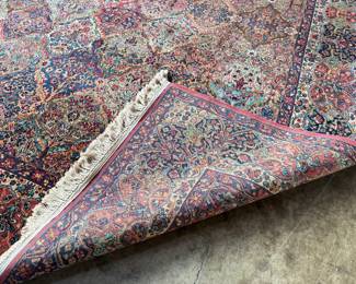 This lot features a Karastan multi-color panel Kirman area rug that measures, 14′ x 10′. 