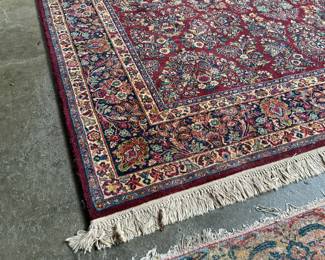 This lot features a stunning 100% wool Red Sarouk Karastan rug that measures, 14′ H x 10′ W.