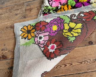 This lot features a latch hook tapestry created in the “rya style, ” a shaggy textile technique that became a home decor staple in the 1960s and ’70s. This piece measures, 36” H x 24” W.