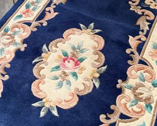 This lot features an antique Chinese floral handmade rug that measures, 60” H x 36” W.