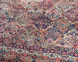 This lot features a Karastan multi-color panel Kirman area rug that measures, 14′ x 10′. 