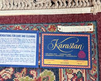 This lot features a stunning 100% wool Red Sarouk Karastan rug that measures, 14′ H x 10′ W.