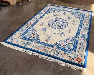 This lot features a hand made 100% wool rug from the People’s Republic of China in a cream color. Measures, 138” H x 99” W.