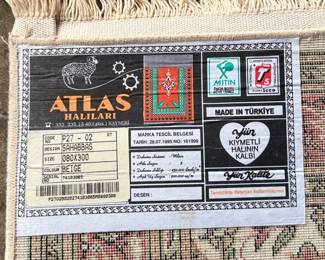 This lot features a Turkish runner rug that measures, 120” H x 32” W.