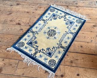 This lot features a Tibetan style Chinese silk rug that measures, 36” H x 24” W.