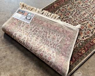 This lot features a Turkish runner rug that measures, 120” H x 32” W.