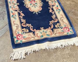 This lot features an antique Chinese floral handmade rug that measures, 60” H x 36” W.