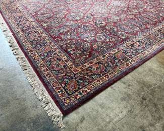 This lot features a stunning 100% wool Red Sarouk Karastan rug that measures, 14′ H x 10′ W.