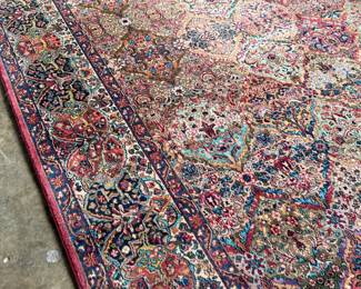 This lot features a Karastan multi-color panel Kirman area rug that measures, 14′ x 10′. 