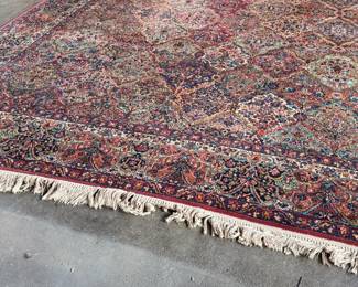 This lot features a Karastan multi-color panel Kirman area rug that measures, 14′ x 10′. 