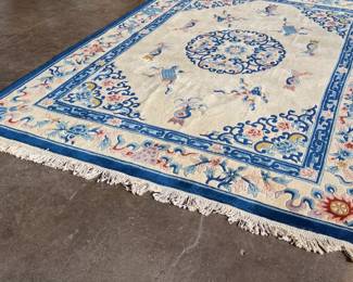 This lot features a hand made 100% wool rug from the People’s Republic of China in a cream color. Measures, 138” H x 99” W.