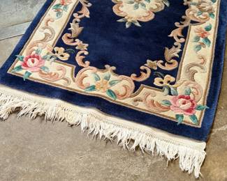 This lot features an antique Chinese floral handmade rug that measures, 60” H x 36” W.