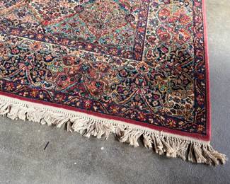 This lot features a Karastan multi-color panel Kirman area rug that measures, 14′ x 10′. 