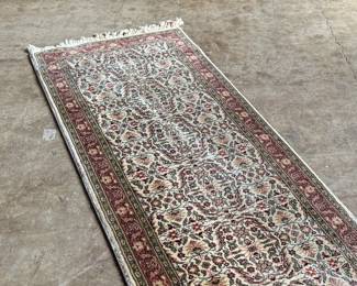 This lot features a Turkish runner rug that measures, 120” H x 32” W.