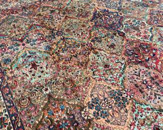 This lot features a Karastan multi-color panel Kirman area rug that measures, 14′ x 10′. 