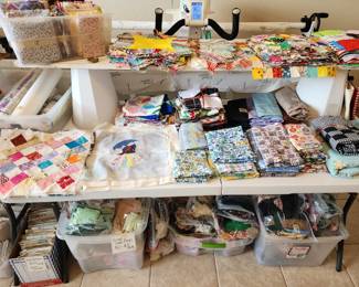 TABLE FULL OF QUILTING ITEMS