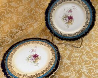Two (2) antique porcelain plates with cobalt blue scalloped rim, and gold  gilded