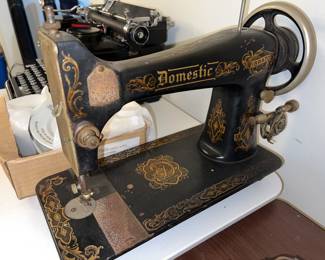 Domestic vibrating shuttle sewing machine