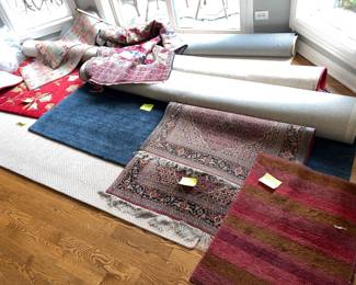 Various colors, styles and sizes of rugs