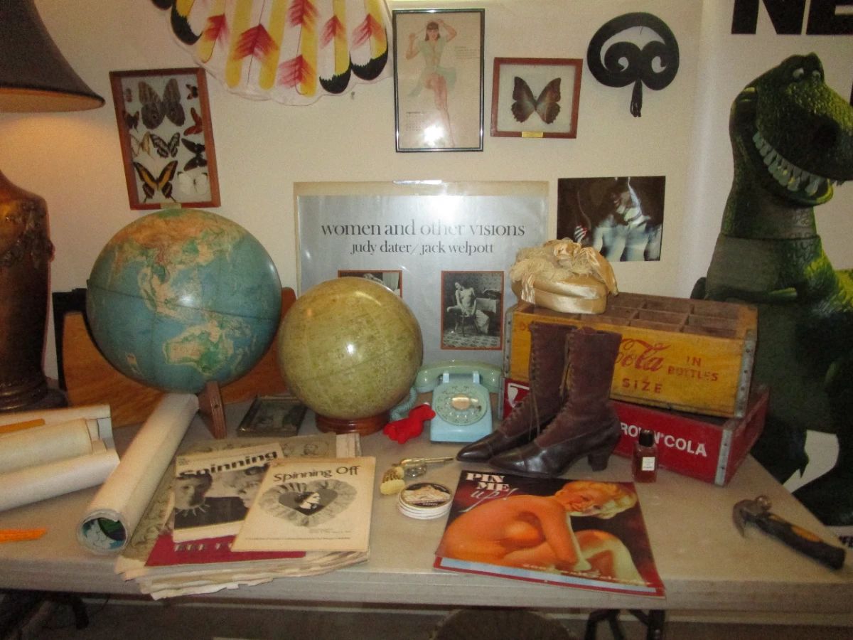 Pop culture explosion, vintage globes, butterfly taxidermy, cool blue rotary phone, old soda crates...