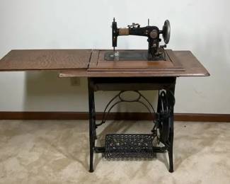 Vintage Treadle Sewing Machine in Oak Cabinet