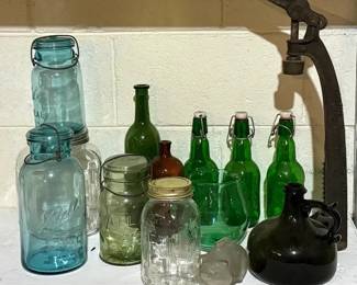 Assorted Glass Bottles, Ball Jars, and Vintage Hand Pump