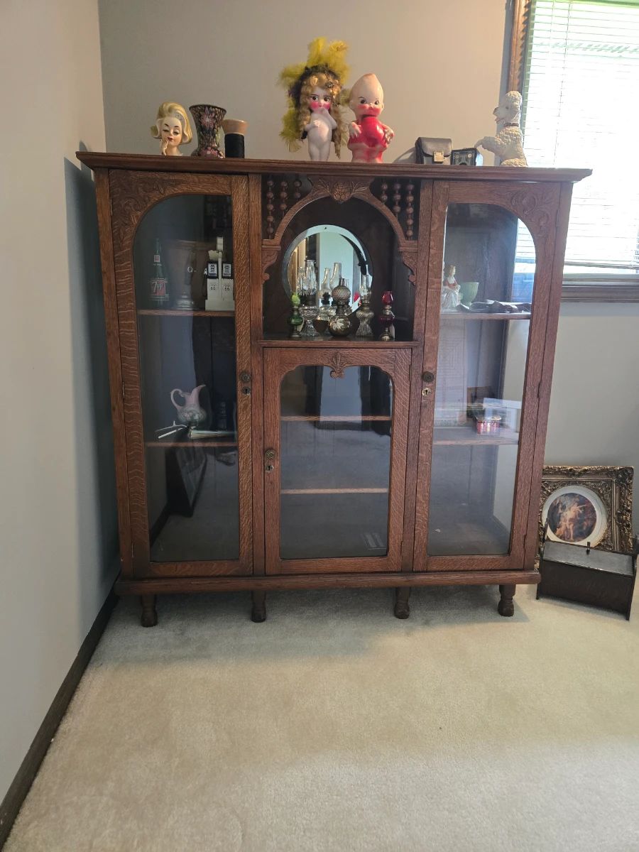 Beautiful antique cabinet full of Antiques
