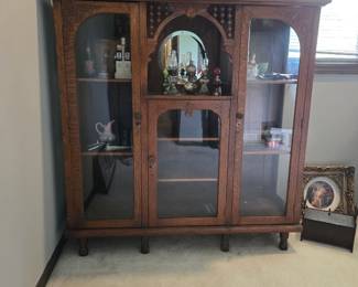 Beautiful antique cabinet full of Antiques