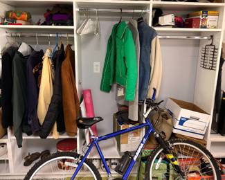 Men's mountain bike and closet of coats and jackets