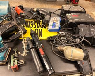Assorted power tools - drills, impact wrench, saws and surge protectors