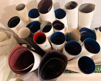 Bin of rolled prints, posters & artwork