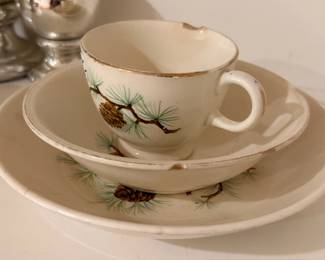 Porcelain teacup and saucer, pinecone pattern with gold trim