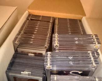 Box of sports cards in toploaders