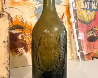Antique embossed olive-green glass bottle (blob-top ale/mineral)
