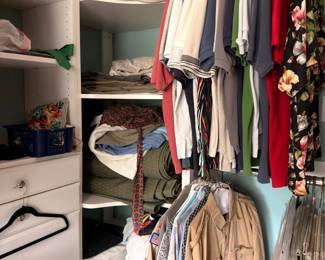 Closet of assorted clothing, shirts and jackets