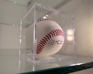 Autographed baseball in display cube