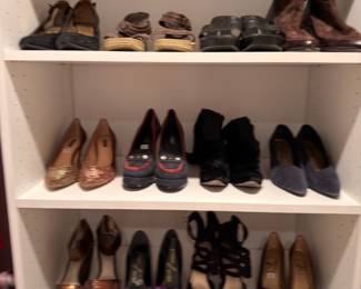 Shelves of women's heels & dress shoes
