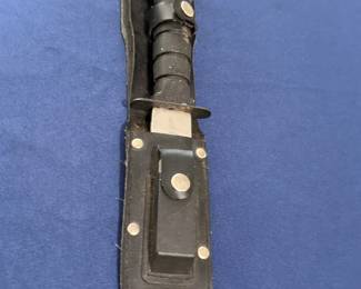 Vintage military combat knife with leather sheath