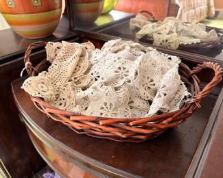 Basket of vintage crocheted lace doilies