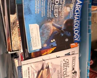 Bin of Archaeology magazines and history books
