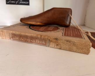 Antique wooden shoe last and vintage book