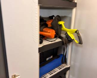 Utility closet with tools and household supplies