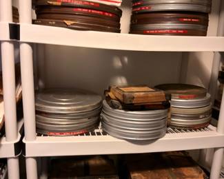 Vintage film reels in metal canisters