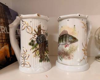 Vintage ceramic pitchers with fish and bird motif, pair
