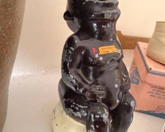 Vintage cast iron seated monkey figure