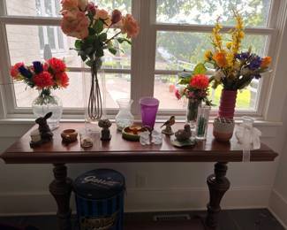 Antique console table with turned legs and assorted decor