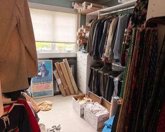 Walk-in closet of men's suits and clothing