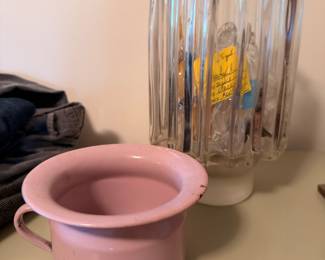 Pink enamelware chamber pot and ribbed glass vase