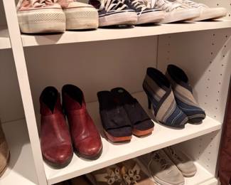 Shelves of women's shoes, boots & sneakers